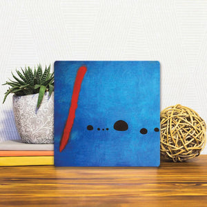 A Slidetile of the Blue Composition sitting on a table.