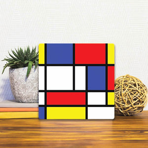 A Slidetile of the Geometry of Colors sitting on a table.