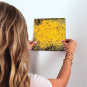 Yellow Grunge Slidetile on wall in office.