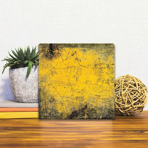 A Slidetile of the Yellow Grunge sitting on a table.