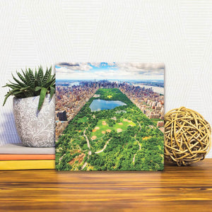 A Slidetile of the Central Park in New York sitting on a table.