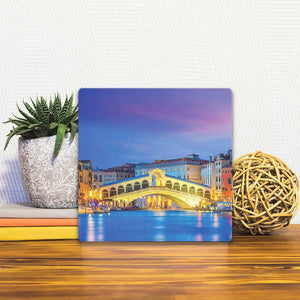 A Slidetile of the Rialto Bridge in Venice sitting on a table.