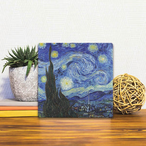 A Slidetile of the Starry night by Van Gogh sitting on a table.