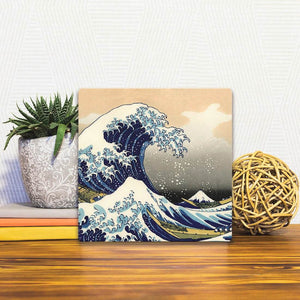 A Slidetile of the The Great Wave sitting on a table.