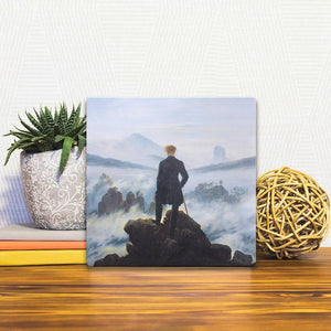 A Slidetile of the Wanderer Above the Sea of Fog sitting on a table.