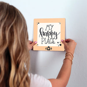 My Happy Place Slidetile on wall in office.
