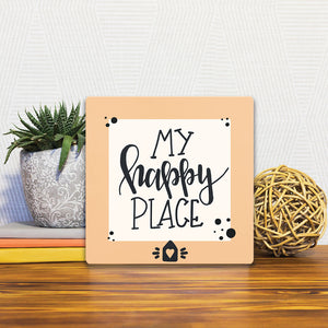 A Slidetile of the My Happy Place sitting on a table.