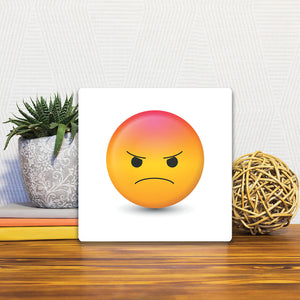 A Slidetile of the Angry Emoji sitting on a table.