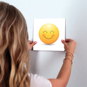 Delighted Emoji Slidetile on wall in office.