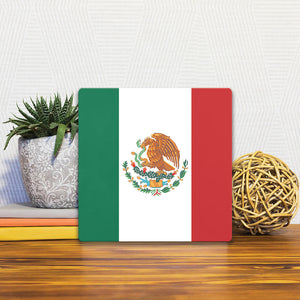A Slidetile of the The Mexican Flag sitting on a table.