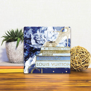 A Slidetile of the Golden Beauty Books sitting on a table.