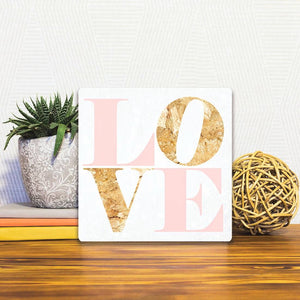 A Slidetile of the Love in Pink sitting on a table.