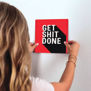 Get Shit Done Slidetile on wall in office.