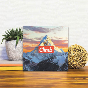 A Slidetile of the Just Climb sitting on a table.