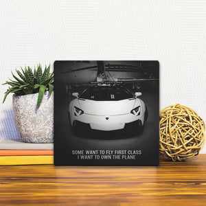 A Slidetile of the I Want to Own the Plane sitting on a table.