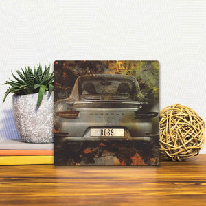 A Slidetile of the Bosses Drive Porsches sitting on a table.