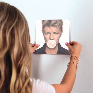 Bowie Blows a Bubble Slidetile on wall in office.