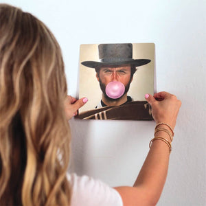 Clint Blows a Bubble Slidetile on wall in office.