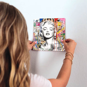 Monroe on Graffiti Slidetile on wall in office.
