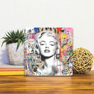 A Slidetile of the Monroe on Graffiti sitting on a table.