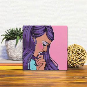 A Slidetile of the Purple Tears sitting on a table.