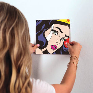I am Wonder Woman Slidetile on wall in office.