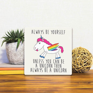 A Slidetile of the Always be yourself sitting on a table.