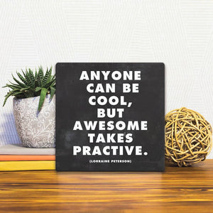 A Slidetile of the Awesome takes practice sitting on a table.
