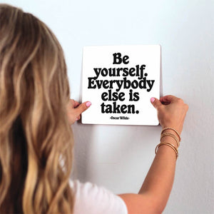 Oscar Wilde - Be yourself Slidetile on wall in office.