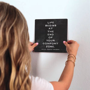 At the end of your comfort zone… Slidetile on wall in office.
