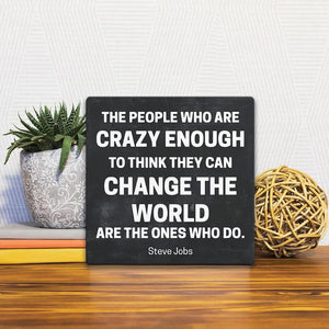 A Slidetile of the The People Who Are Crazy Enough… sitting on a table.