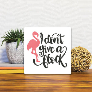 A Slidetile of the I don't give a flock sitting on a table.