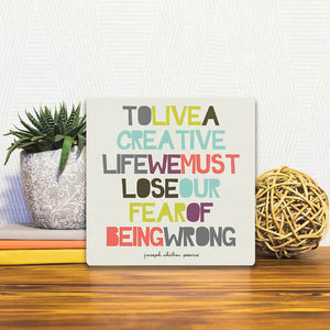 A Slidetile of the Love our fear of being wrong… sitting on a table.