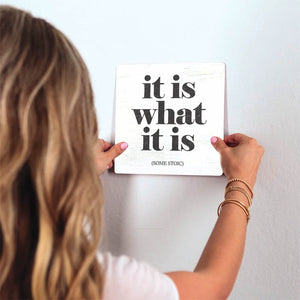 It Is What It Is Slidetile on wall in office.