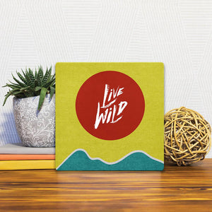 A Slidetile of the Live Wild sitting on a table.