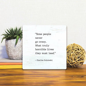 A Slidetile of the Some People Never Go Crazy sitting on a table.