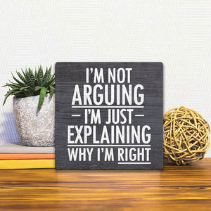 A Slidetile of the I'm Not Arguing sitting on a table.