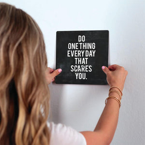 Do one thing every day… Slidetile on wall in office.