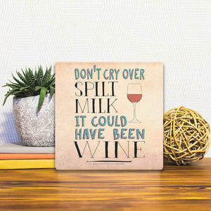 A Slidetile of the Don't cry over spilt milk… sitting on a table.
