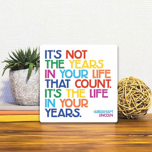 A Slidetile of the It's not the years in your life… sitting on a table.