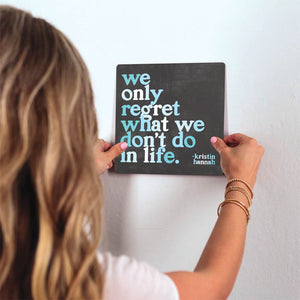 We Only Regret What We Don't Do Slidetile on wall in office.