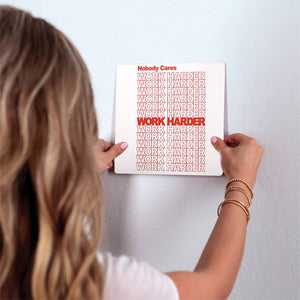 Work harder… Slidetile on wall in office.