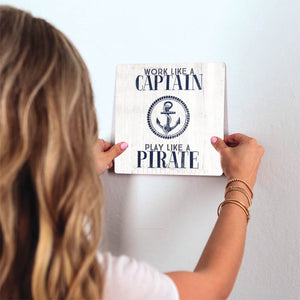 Work like a captain… Slidetile on wall in office.