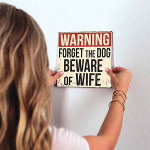 Beware of Wife Slidetile on wall in office.