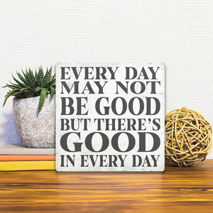 A Slidetile of the Good in Everyday sitting on a table.