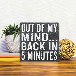 A Slidetile of the Out of My Mind… sitting on a table.
