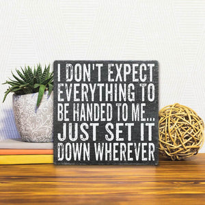 A Slidetile of the Set It Down Wherever sitting on a table.