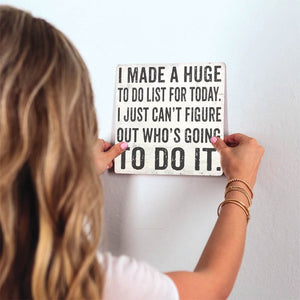 Who's Going to Do It Slidetile on wall in office.