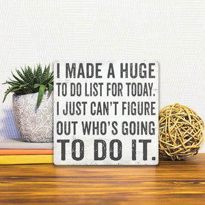 A Slidetile of the Who's Going to Do It sitting on a table.