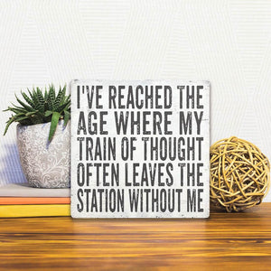 A Slidetile of the My Train of Thought sitting on a table.